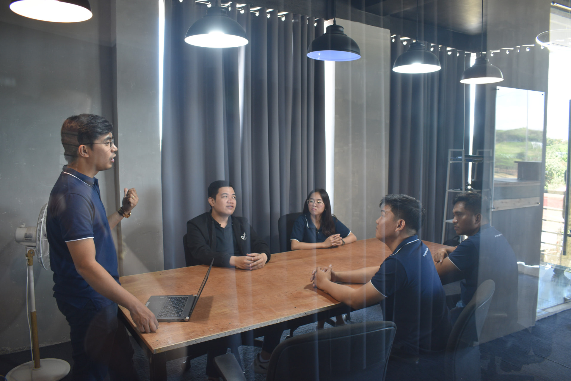 Team discussion around the conference table